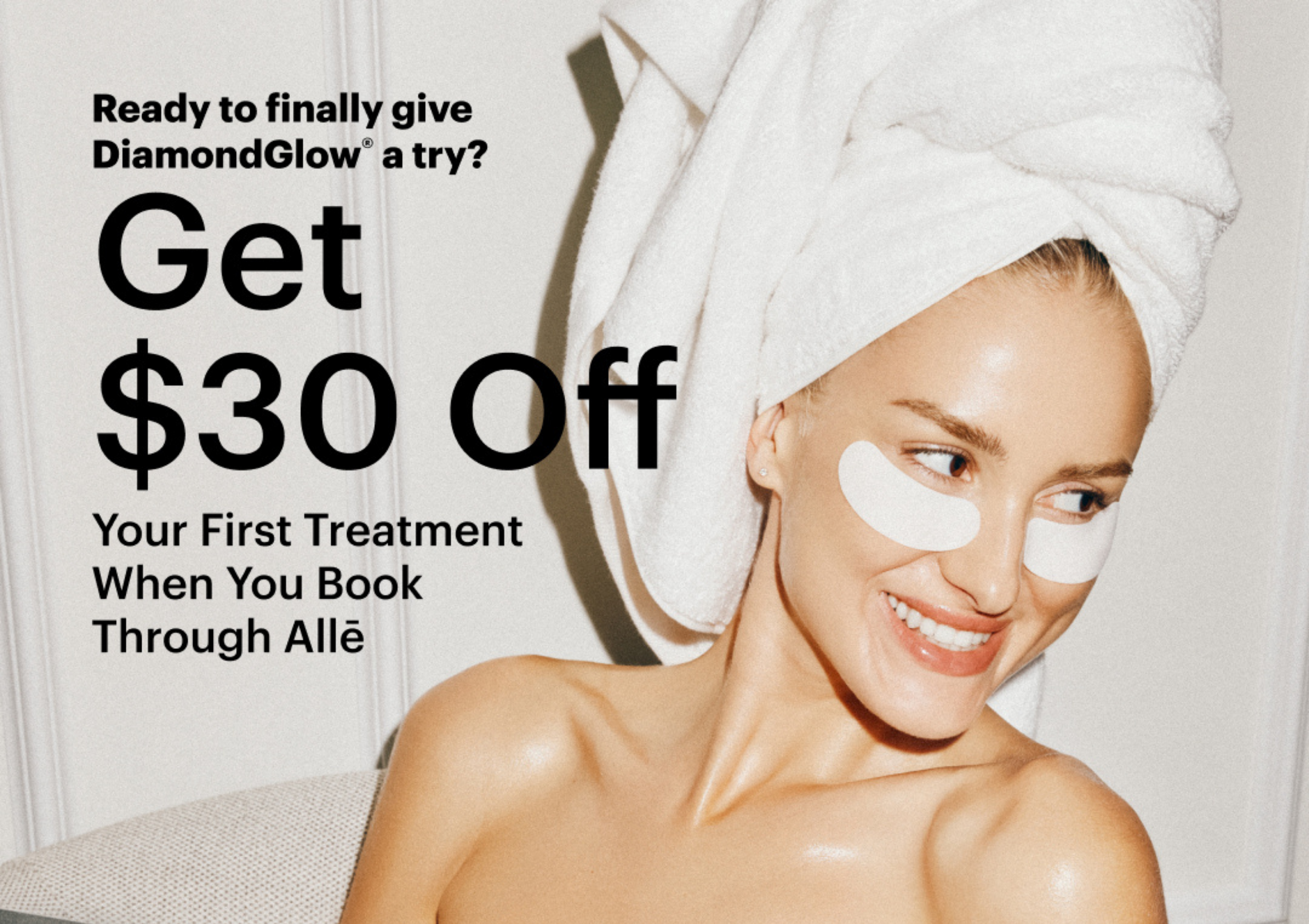 Promo banner showing a smiling woman with a towel on her head, offering  off first DiamondGlow treatment.
